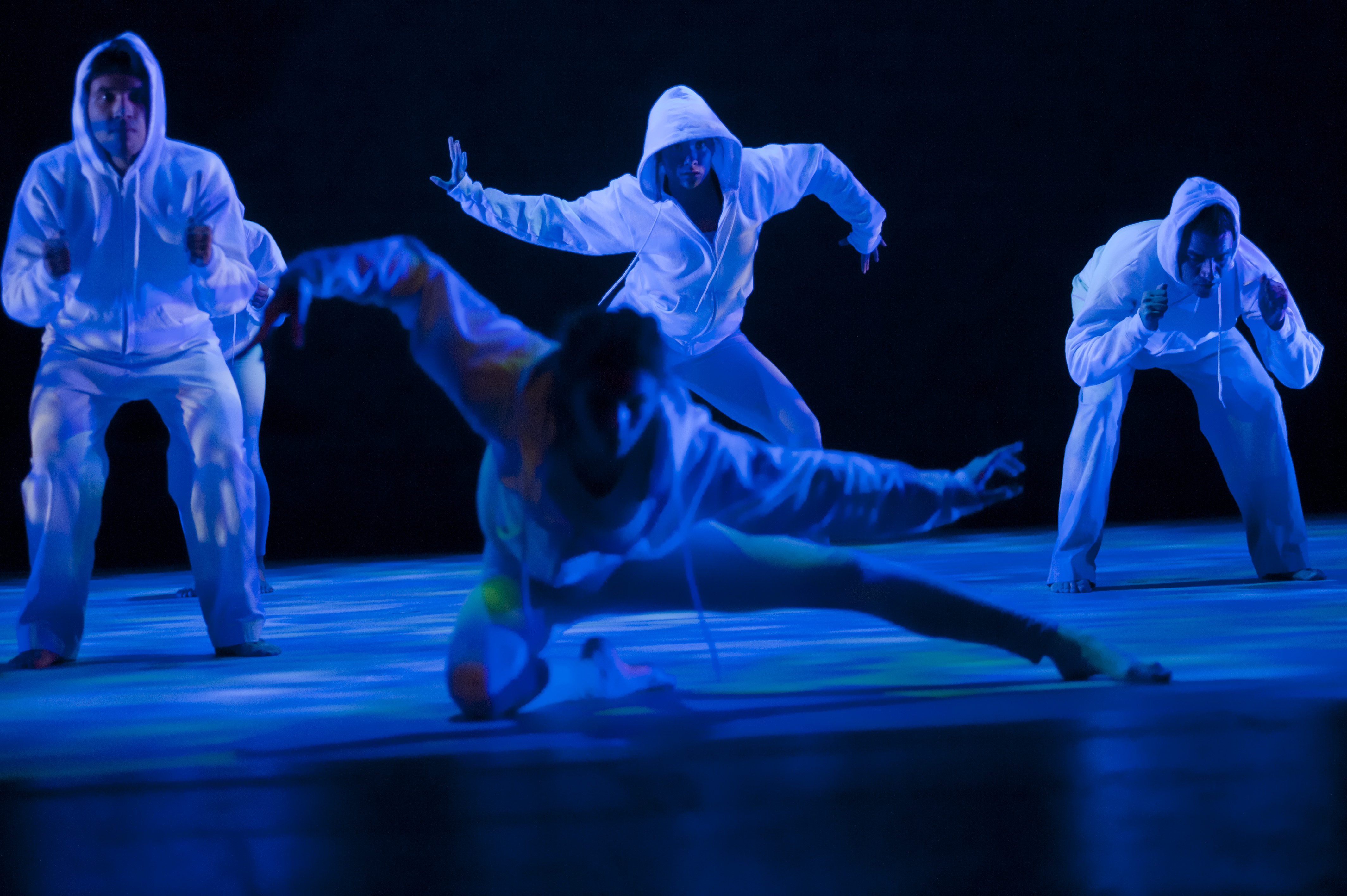 Need descriptions for each of the images       Intermediate Ballet Technique class          dancer flying off back of another dancer          duet using chair as a prop          confetti in air, dancers showing exuberance          dancers in Chinese folk fan dance          dancers making a group shape that is reaching for light          dancers holding umbrellas upward, with delight          duet dancing with sofa          duet in soft blue light, making a pose          dancers on stage in blue light in a lunge          dancers in circle surrounding a soloist          duet dancing in soft blue light in a curved shaped pose          duet in a lift