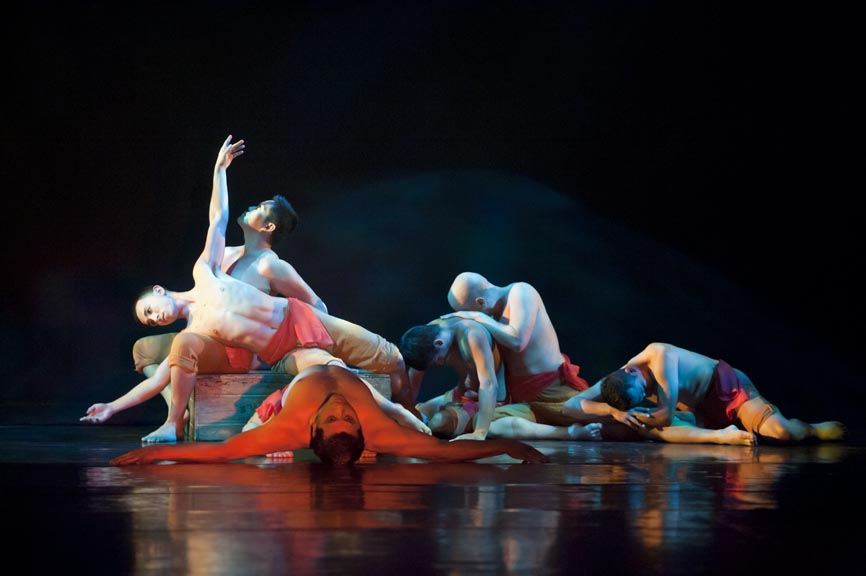 Need descriptions for each of the images       Intermediate Ballet Technique class          dancer flying off back of another dancer          duet using chair as a prop          confetti in air, dancers showing exuberance          dancers in Chinese folk fan dance          dancers making a group shape that is reaching for light          dancers holding umbrellas upward, with delight          duet dancing with sofa          duet in soft blue light, making a pose          dancers on stage in blue light in a lunge          dancers in circle surrounding a soloist          duet dancing in soft blue light in a curved shaped pose          duet in a lift
